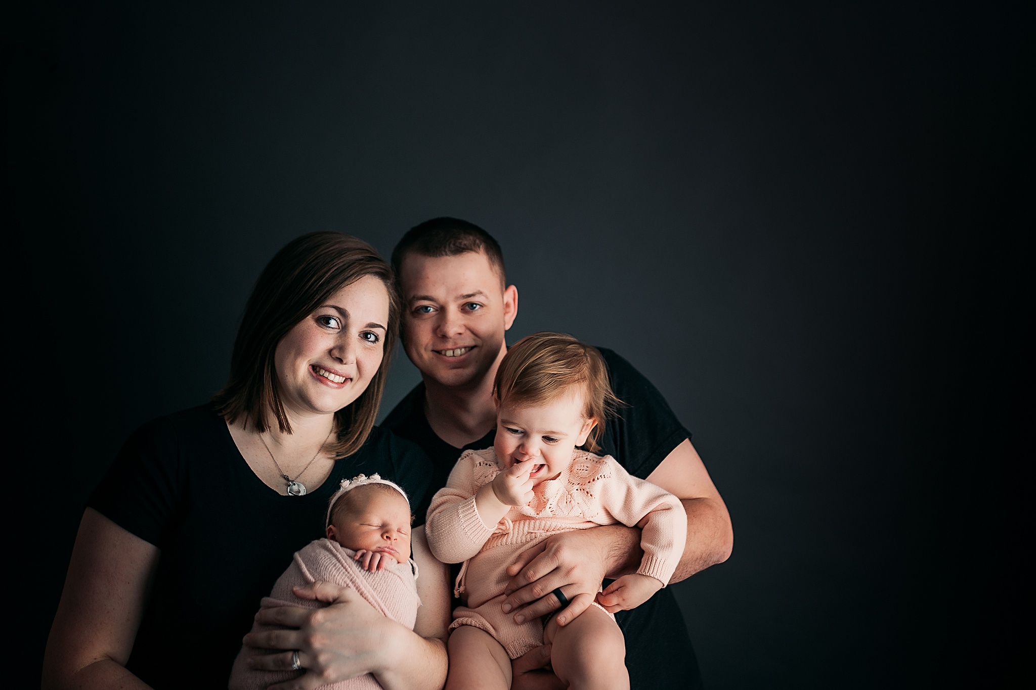 Family of 4 with newborn baby