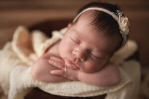 Charlottesville Newborn Photographer Photographing beautiful baby girl in yellow laying in bucket