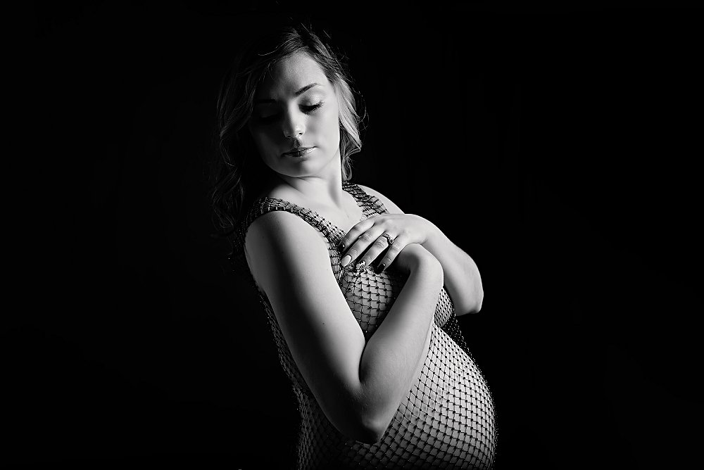 Black and white studio maternity pose