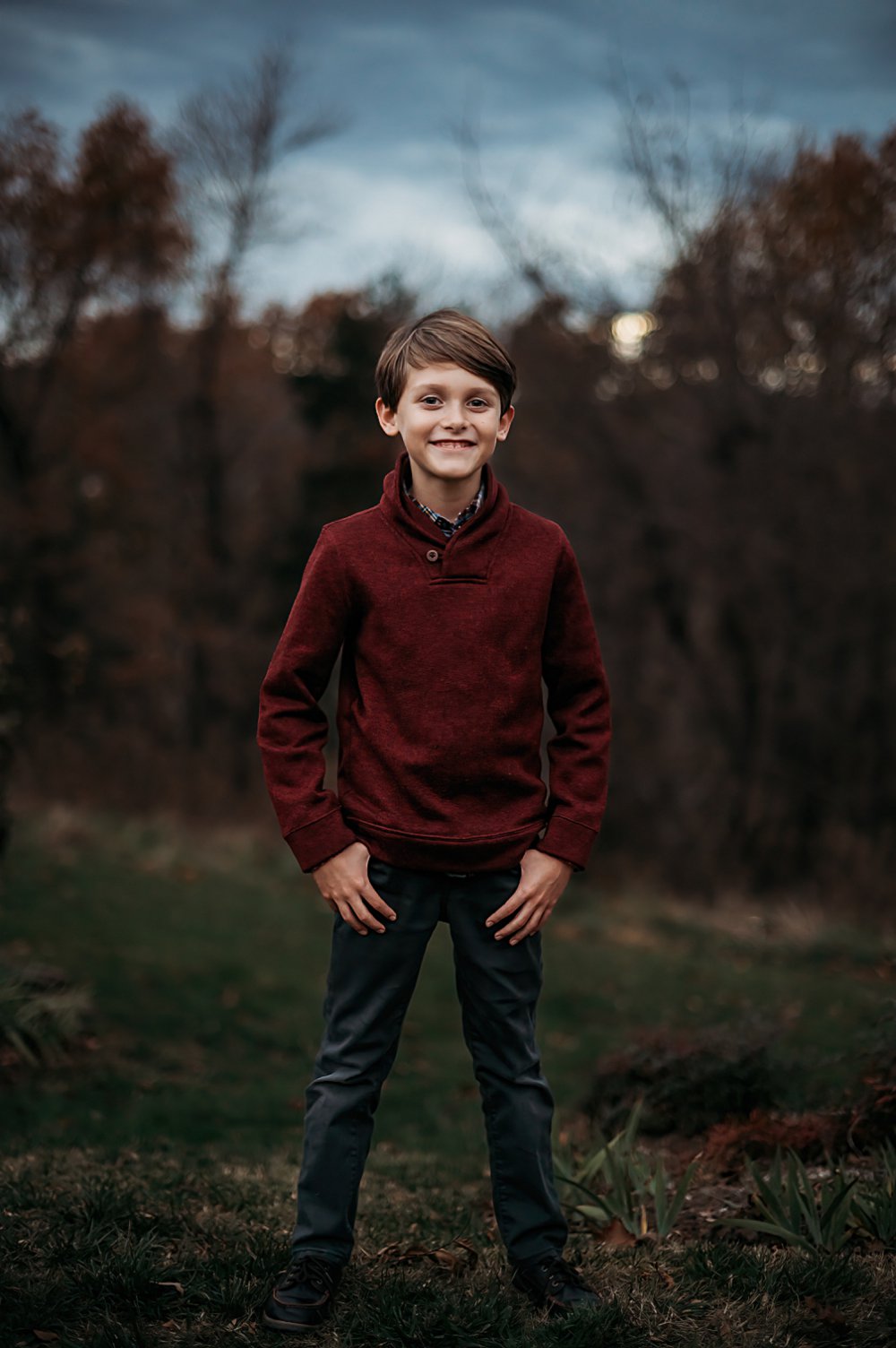 handsome boy standing on a hill at the Clifton inn in Charlottesville for his mini photography session