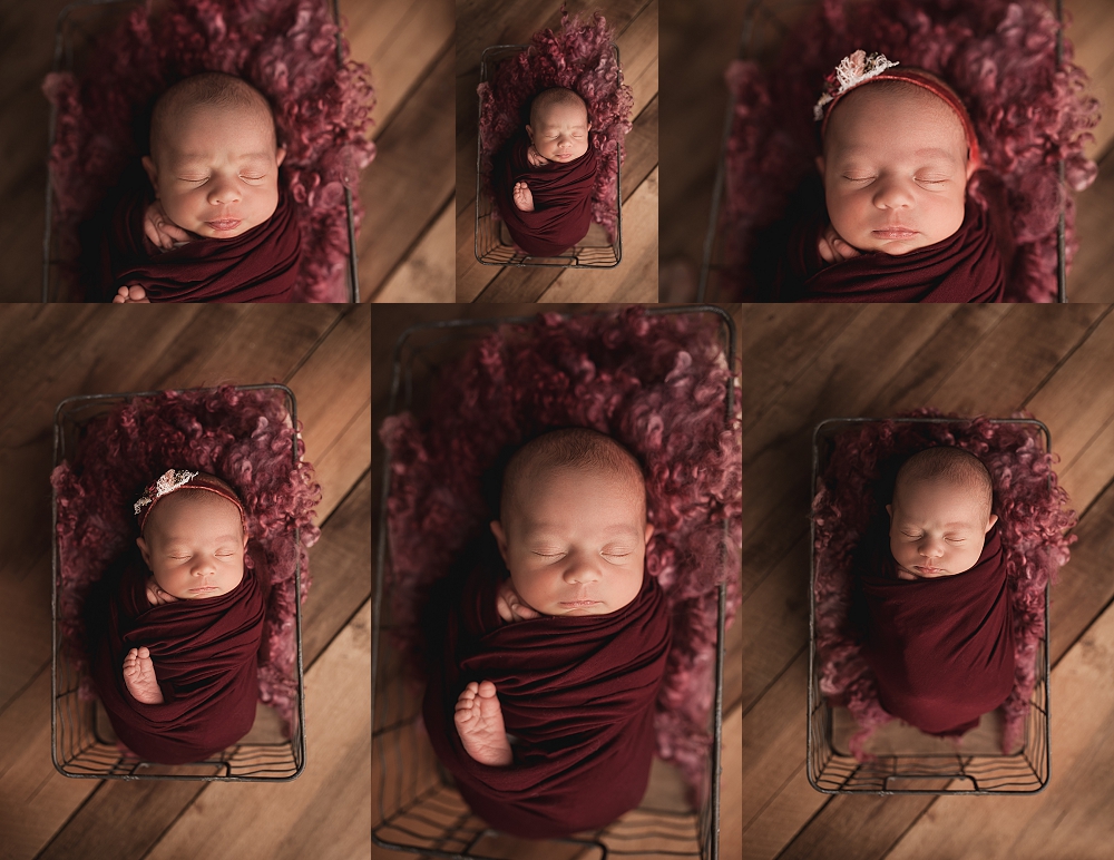 newborn swaddled in a red wrap posed in a basket