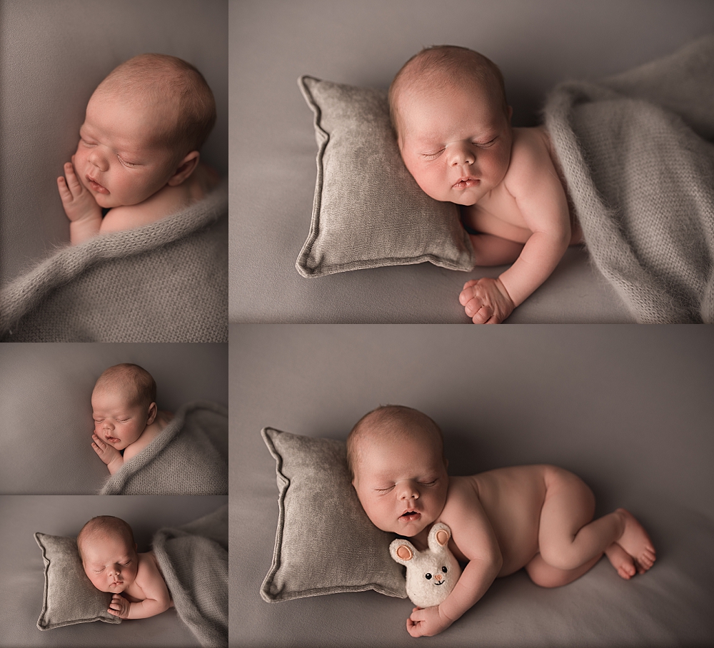 newborn with grey background on a pillow
