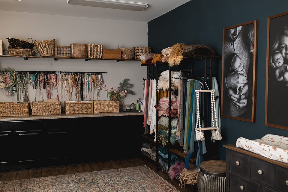 Studio wardrobe and prop display for newborn photography in Crozet, Virginia