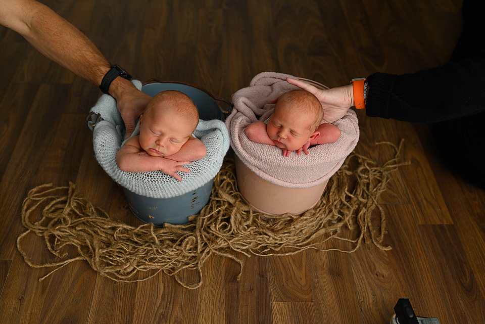 Safe newborn photography posing with hands supporting baby
